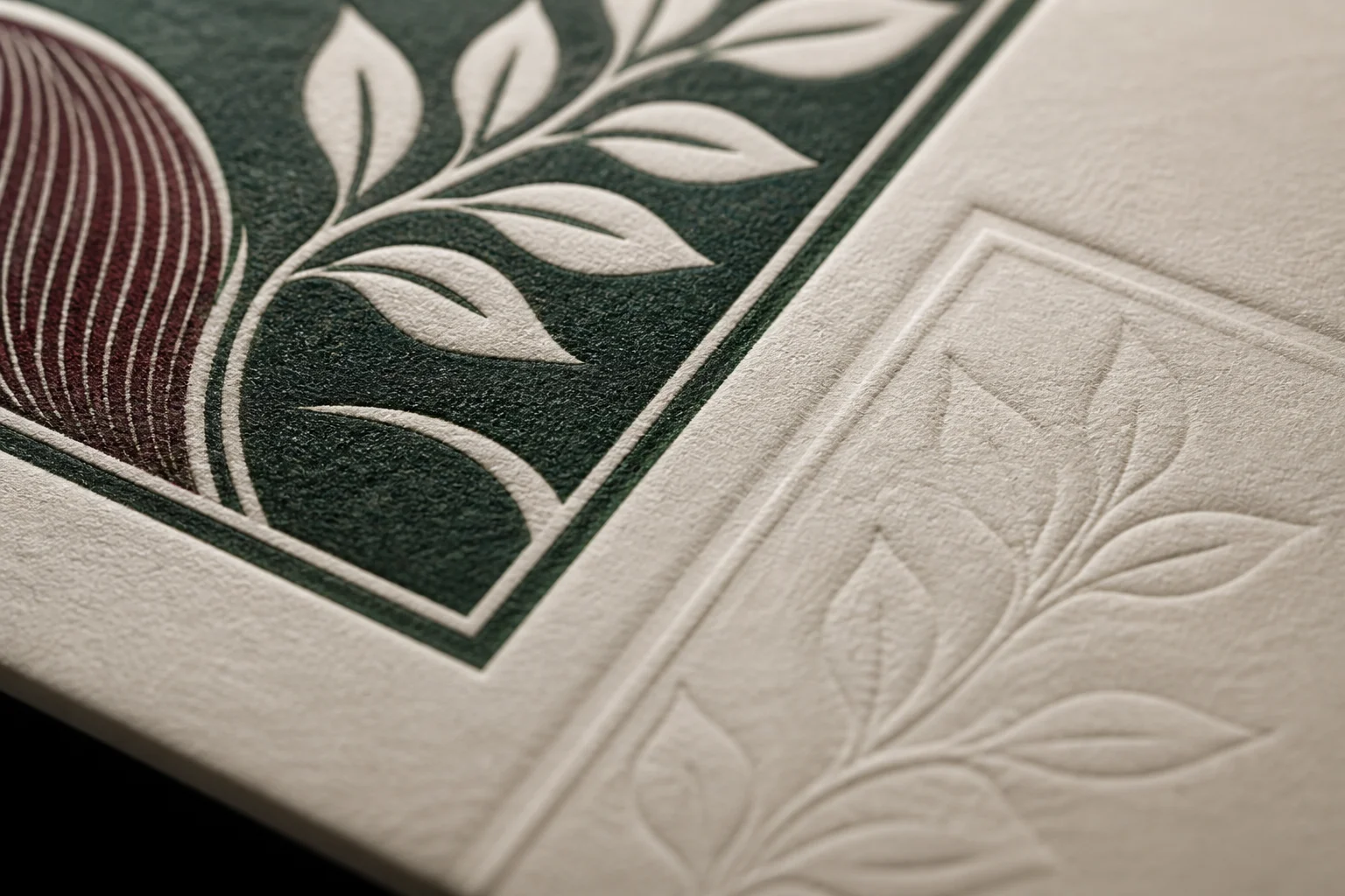 Close-up of inked and blind-debossed details in textured cotton paper